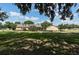 Charming single story home boasts a sprawling lawn and separate detached garage at 7721 Forest Way, Lakeland, FL 33810