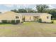 Inviting one-story home with well-maintained lawn, quaint front porch, and lovely curb appeal at 7721 Forest Way, Lakeland, FL 33810