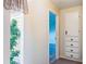 Hallway with built-in storage leading to another room at 7721 Forest Way, Lakeland, FL 33810