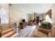 Spacious living room with light wood floors, neutral walls, and a ceiling fan at 7721 Forest Way, Lakeland, FL 33810