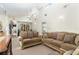 Cozy living area with vaulted ceilings, natural light, and comfortable seating at 7721 Forest Way, Lakeland, FL 33810