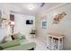 Cozy living space with light-colored walls, tile flooring, and comfortable seating at 7721 Forest Way, Lakeland, FL 33810