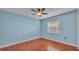 Cozy bedroom with ceiling fan and window at 7741 Merrily Way, Lakeland, FL 33809