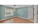Dining room with modern lighting and large window at 7741 Merrily Way, Lakeland, FL 33809