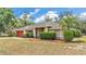 Well-maintained one story home with mature trees and inviting curb appeal at 7741 Merrily Way, Lakeland, FL 33809