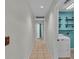 Hallway leading to a laundry area and other rooms at 7741 Merrily Way, Lakeland, FL 33809