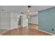 Open-concept living space with tile flooring and view to kitchen at 7741 Merrily Way, Lakeland, FL 33809