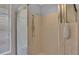 Enclosed shower with standard shower head and tiled walls at 7741 Merrily Way, Lakeland, FL 33809