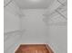 Empty walk-in closet with ample shelving and storage at 7741 Merrily Way, Lakeland, FL 33809