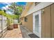 Backyard featuring a brick patio and the exterior of the home at 865 E Mann Rd, Bartow, FL 33830