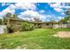 The expansive backyard featuring the exterior of the home at 865 E Mann Rd, Bartow, FL 33830