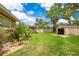 The beautiful lawn and shed in this spacious backyard at 865 E Mann Rd, Bartow, FL 33830