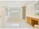 Bright bathroom with double vanity, bathtub, walk-in shower, and natural light at 865 E Mann Rd, Bartow, FL 33830