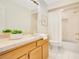 Bright bathroom featuring a tub with shower, light wood vanity and neutral tile at 865 E Mann Rd, Bartow, FL 33830