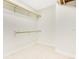 Walk-in closet with tile floors and simple rod and shelf organization at 865 E Mann Rd, Bartow, FL 33830
