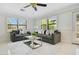 Cozy living room with two sofas, plantation shutters, and ample natural light create a warm, welcoming atmosphere at 865 E Mann Rd, Bartow, FL 33830