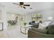 Open-concept living space with comfortable seating, modern lighting, and seamless flow to the dining area at 865 E Mann Rd, Bartow, FL 33830