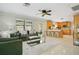 Open-concept living space combining the kitchen and living area, offering a relaxed atmosphere with natural light at 865 E Mann Rd, Bartow, FL 33830