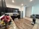 Modern kitchen with stainless steel appliances, granite countertops, and dark cabinets at 879 Grandin St, Davenport, FL 33837