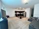 Bright, open-concept living space seamlessly connects to a modern kitchen at 879 Grandin St, Davenport, FL 33837