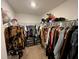 Organized walk-in closet with ample hanging space and storage for shoes and accessories at 879 Grandin St, Davenport, FL 33837