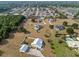 Aerial view of a residential neighborhood features homes with spacious lots and mature trees at 8909 N Campbell Rd, Lakeland, FL 33810