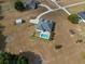 Aerial view of a home, pool and large lot at 8909 N Campbell Rd, Lakeland, FL 33810