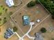 Aerial view of the home and pool, nestled on a large grassy lot at 8909 N Campbell Rd, Lakeland, FL 33810