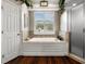 Luxurious bathroom with a soaking tub, tiled walls, and a glass-enclosed shower at 8909 N Campbell Rd, Lakeland, FL 33810