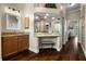 Bathroom with granite counters, wood cabinets, and a vanity area with a stool at 8909 N Campbell Rd, Lakeland, FL 33810