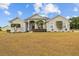 Charming single-story home with well-manicured landscaping and inviting front entrance at 8909 N Campbell Rd, Lakeland, FL 33810