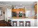 Open kitchen design with granite countertops, wood cabinets and stainless steel appliances at 8909 N Campbell Rd, Lakeland, FL 33810