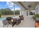 This screened patio features plenty of seating and a view of the pool at 8909 N Campbell Rd, Lakeland, FL 33810