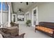 Covered patio with ceiling fans, wicker furniture, and view of backyard at 8909 N Campbell Rd, Lakeland, FL 33810