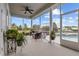 Screened patio with columns overlooking the pool and yard, and features nice patio furniture at 8909 N Campbell Rd, Lakeland, FL 33810