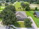 Charming home featuring lush landscaping, mature trees, and a private driveway in a serene setting at 1001 Lena Run Ct, Winter Haven, FL 33880