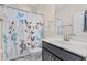 Clean bathroom with decorative shower curtain, vanity, and brushed nickel finishes at 1001 Lena Run Ct, Winter Haven, FL 33880