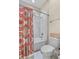 Bathroom featuring a tub with decorative shower curtain, white tiles, and ample lighting at 1001 Lena Run Ct, Winter Haven, FL 33880