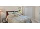 Bright bedroom with a large window, wooden bed frame, and a large closet at 1001 Lena Run Ct, Winter Haven, FL 33880