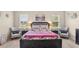 Bright bedroom features two chairs, a king bed, and elegant decor at 1001 Lena Run Ct, Winter Haven, FL 33880