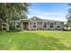 Charming home with stone accents, well-manicured lawn, and lush landscaping creating great curb appeal at 1001 Lena Run Ct, Winter Haven, FL 33880