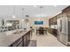 Bright, modern kitchen with stainless steel appliances and granite countertops, adjacent to dining area at 1001 Lena Run Ct, Winter Haven, FL 33880