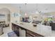 Modern kitchen overlooks a large living room and breakfast bar at 1001 Lena Run Ct, Winter Haven, FL 33880