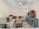 Spacious living room featuring a large sectional sofa, TV, and neutral tones for a relaxing atmosphere at 1001 Lena Run Ct, Winter Haven, FL 33880