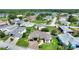 Beautiful home showcasing lush landscaping in a peaceful neighborhood near a scenic lake at 1056 Rally Dr, Polk City, FL 33868