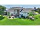 Expansive backyard with an outdoor patio, barbeque, and lush greenery, perfect for relaxing at 1056 Rally Dr, Polk City, FL 33868