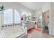 The bathroom features a whirlpool tub, double sinks, and a glass enclosed shower at 1056 Rally Dr, Polk City, FL 33868
