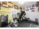 Bright exercise room with treadmill, elliptical, weight bench, and fun sports memorabilia at 1056 Rally Dr, Polk City, FL 33868