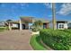 Inviting home with lush landscaping, a covered carport, and a beautifully maintained front yard at 1056 Rally Dr, Polk City, FL 33868