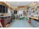 Spacious garage with organized shelving and work areas, ideal for storage and hobbies at 1056 Rally Dr, Polk City, FL 33868